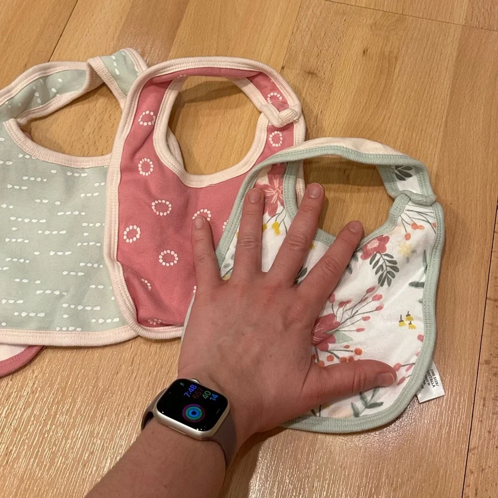 Set of four girls patterned cloud island bibs